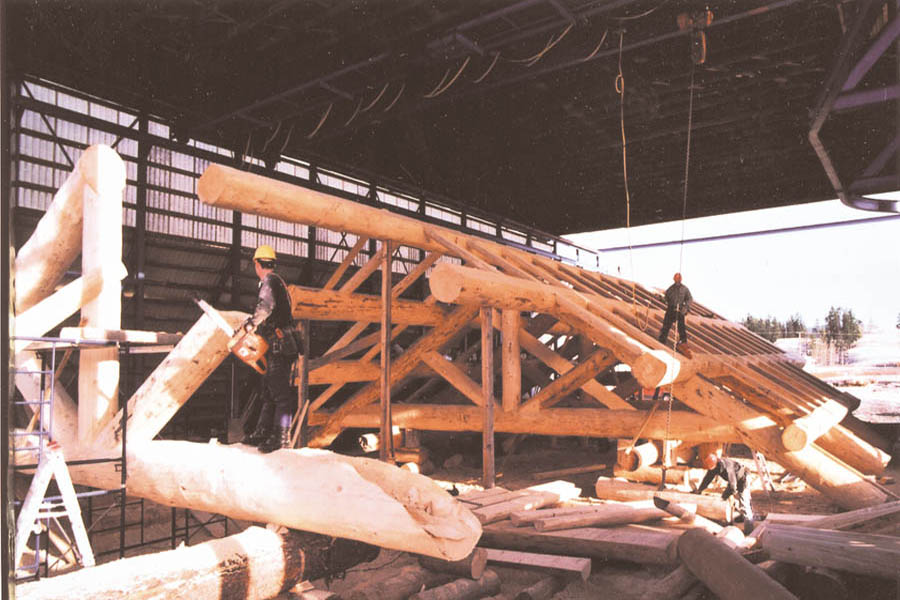 Doing final cuts on massive log trusses